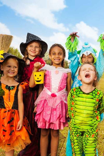 Kids Outside Dressed in Halloween Costumes